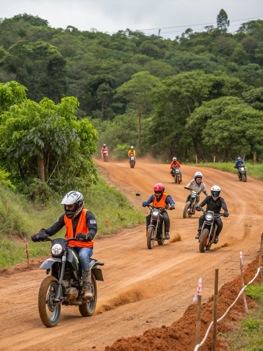 A group of motocross enthusiasts gathered for a safety briefing before a training session at MOTO CLUB DE PRANZAC, emphasizing the club's commitment to safe riding practices.